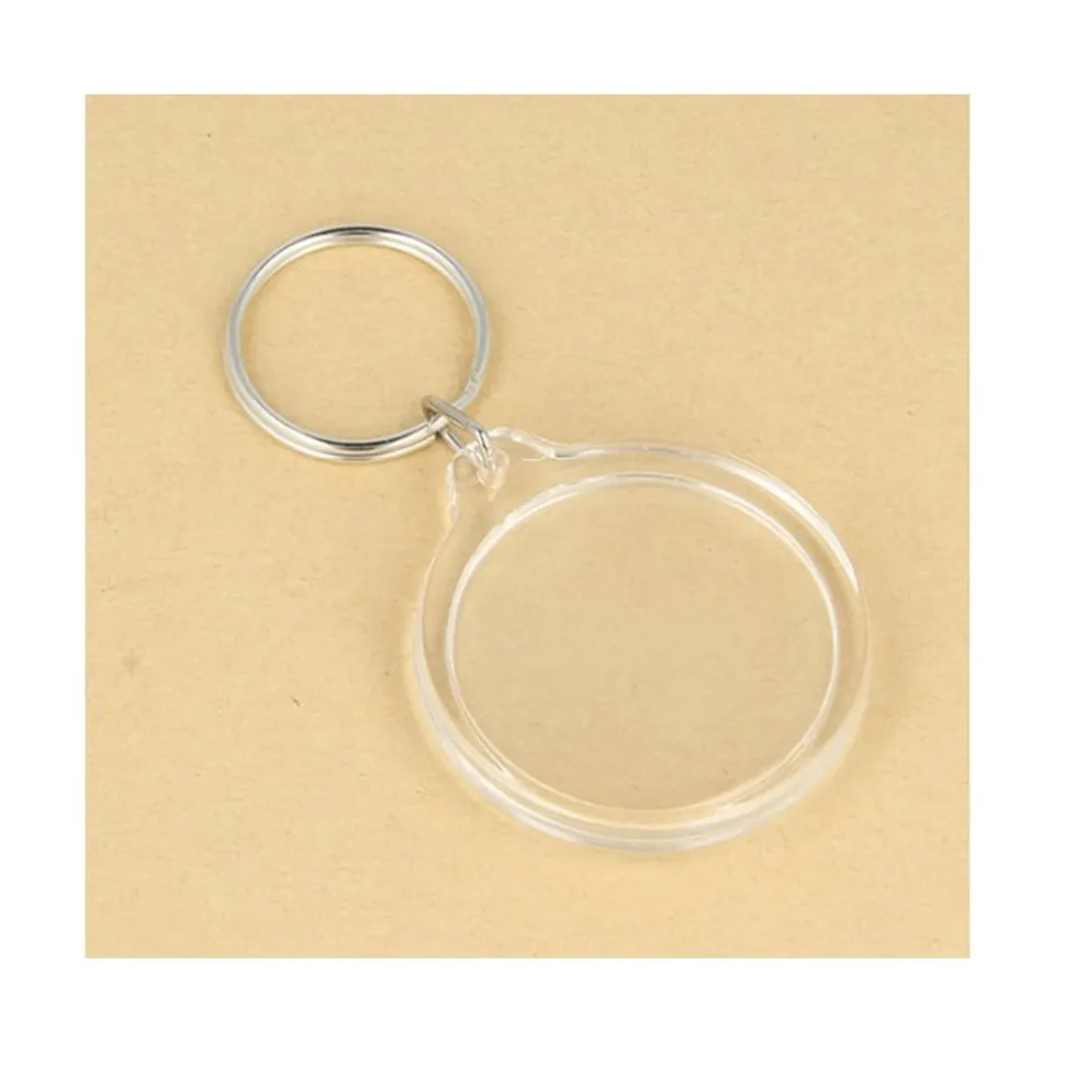 4 PORTE-CLÉS PHOTO ROND TRANSPARENT 35MM